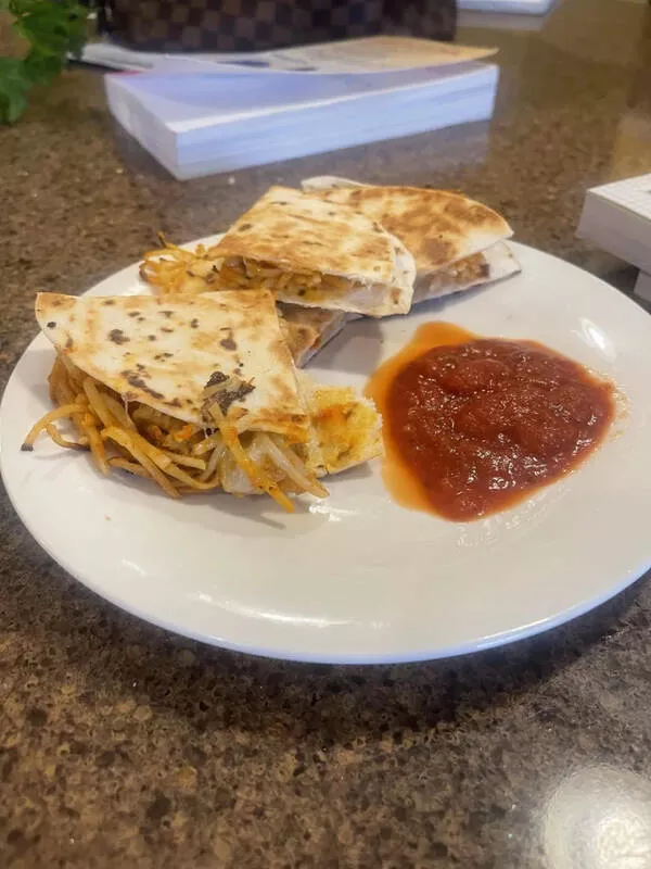 Palate puzzles exploring bizarre food pairings that challenge your taste buds - #13 Spaghetti quesadilla. In my defense, I'm 8 and a half months pregnant.