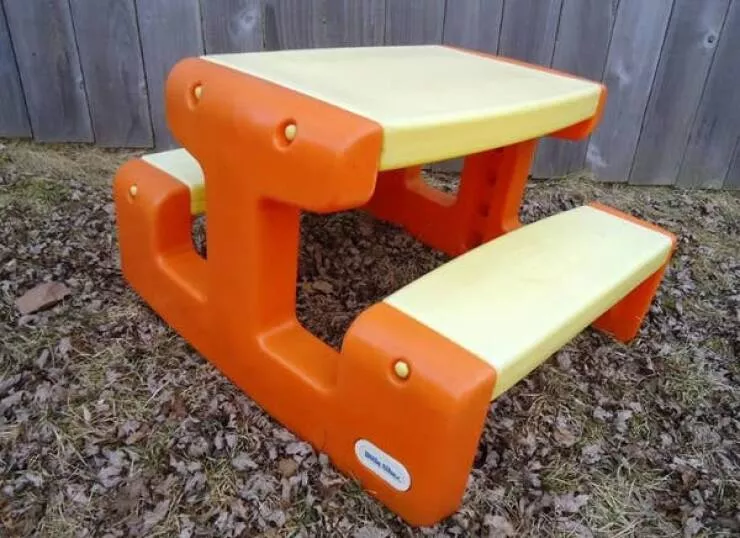 Rediscovering 90s nostalgia treasures from every millennials childhood home - #3 The orange and yellow Little Tikes Picnic Table, typically covered in crayon and marker scribbles or faded from sun exposure in the backyard